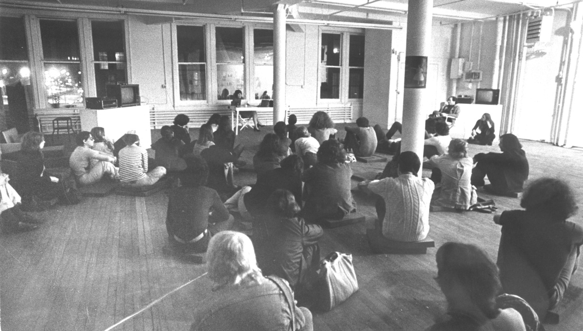 Audience gathered for a poetry reading by Jennifer Bartlett, April 23, 1974, as part of a performance and film series curated for Artists Space, April 23 &amp;ndash; April 26, 1974.